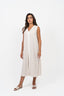 Robe longue sans manches couleur beige avec une rayure blanche au centre.