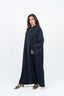 Abaya bleu marine avec incrustations au col.