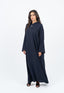 Abaya bleu marine avec incrustations au col.