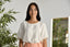 Blouse en lin avec finitions tressées.
